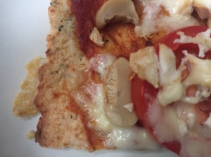 Close-up picture of cauliflower pizza crust.